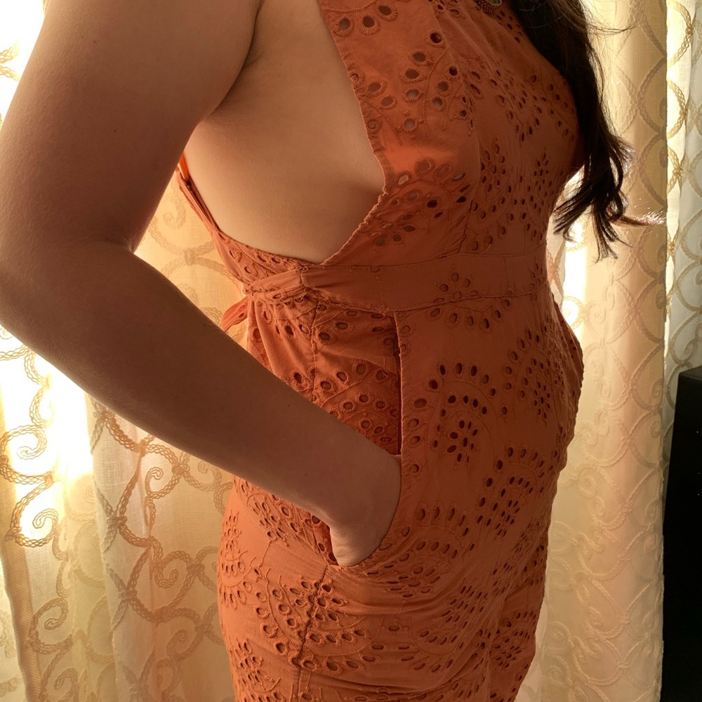 Lace jumpsuit. Belted with adjustable straps.